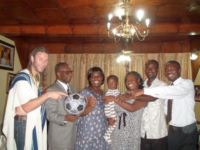 Kweku and his family embrace Andrew and The Ball