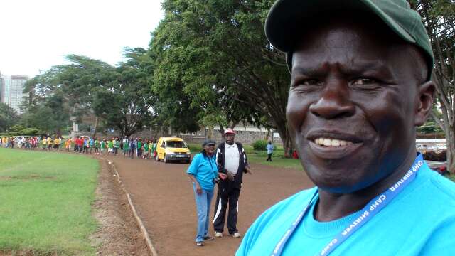 Peter Wanderi waits for the parade