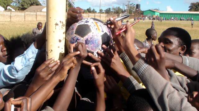 Mass signing of The Ball at Lusaka school