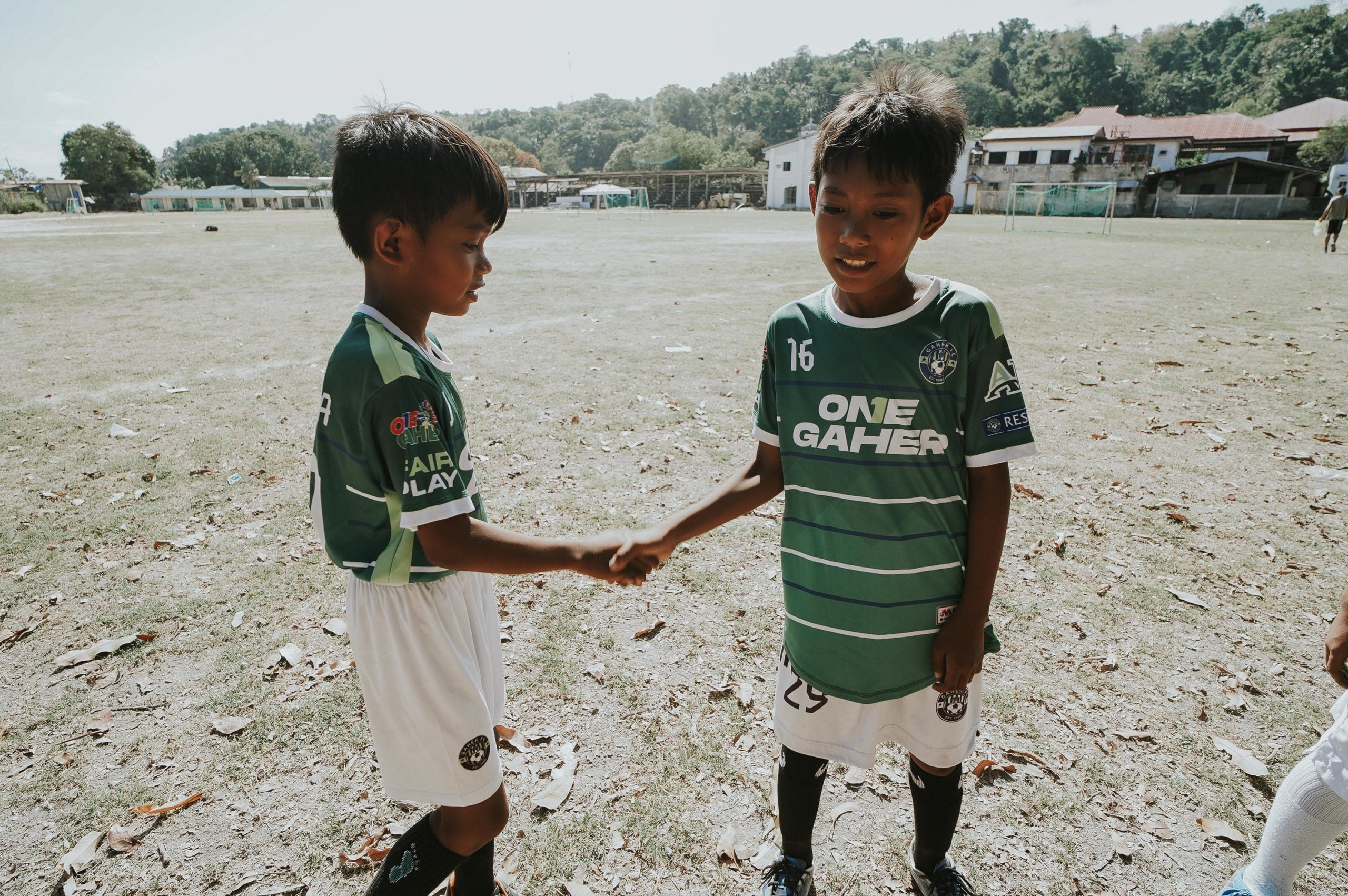 Bohol-football-handshake-2-boys-min
