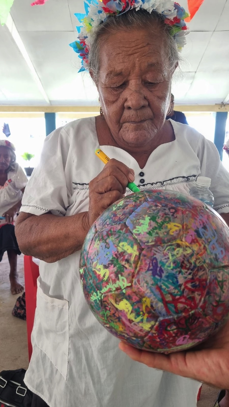 Betio woman signing the Ball