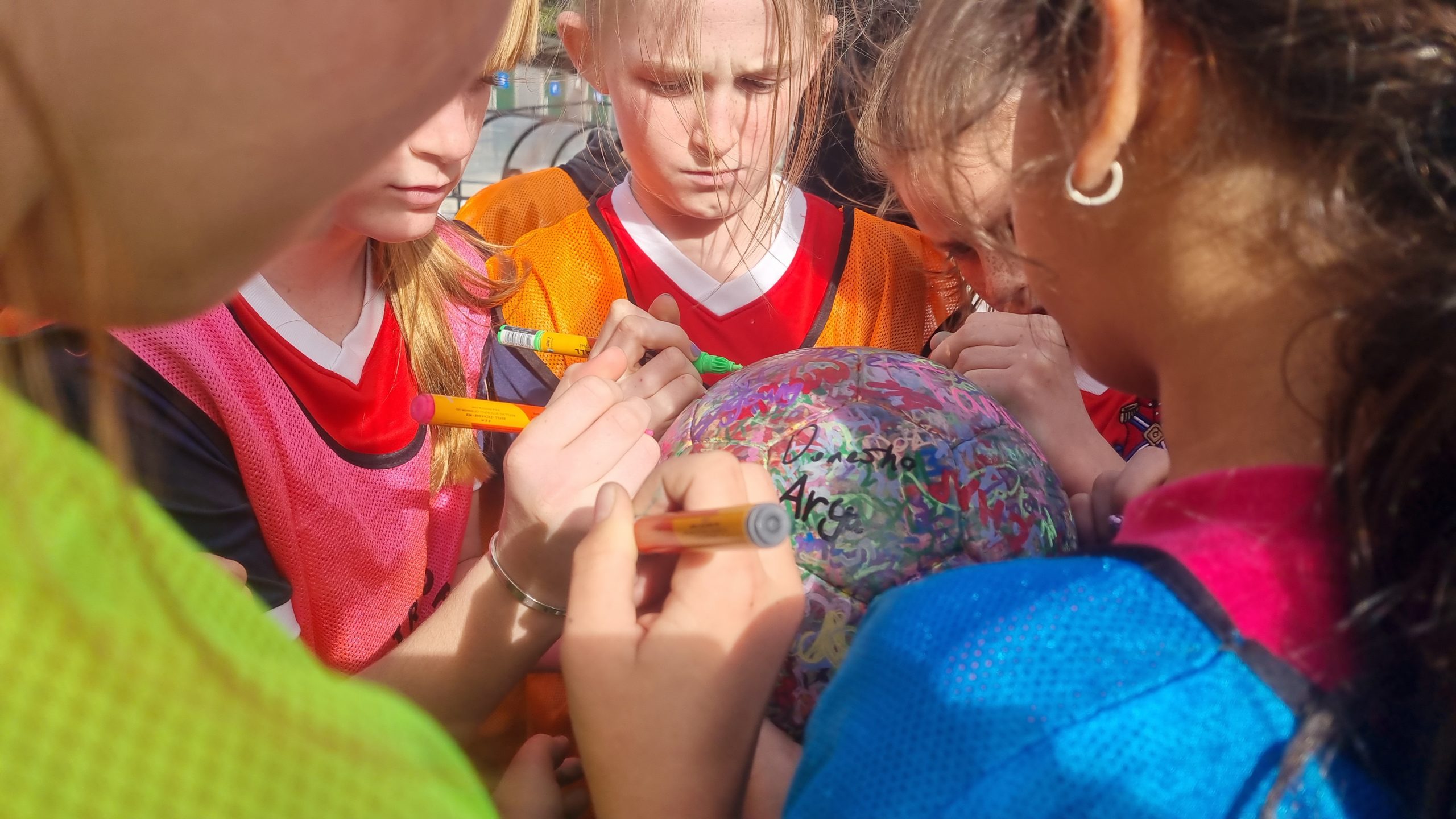 Kids at the Fencibles Holiday Program sign The Ball (July 2023)