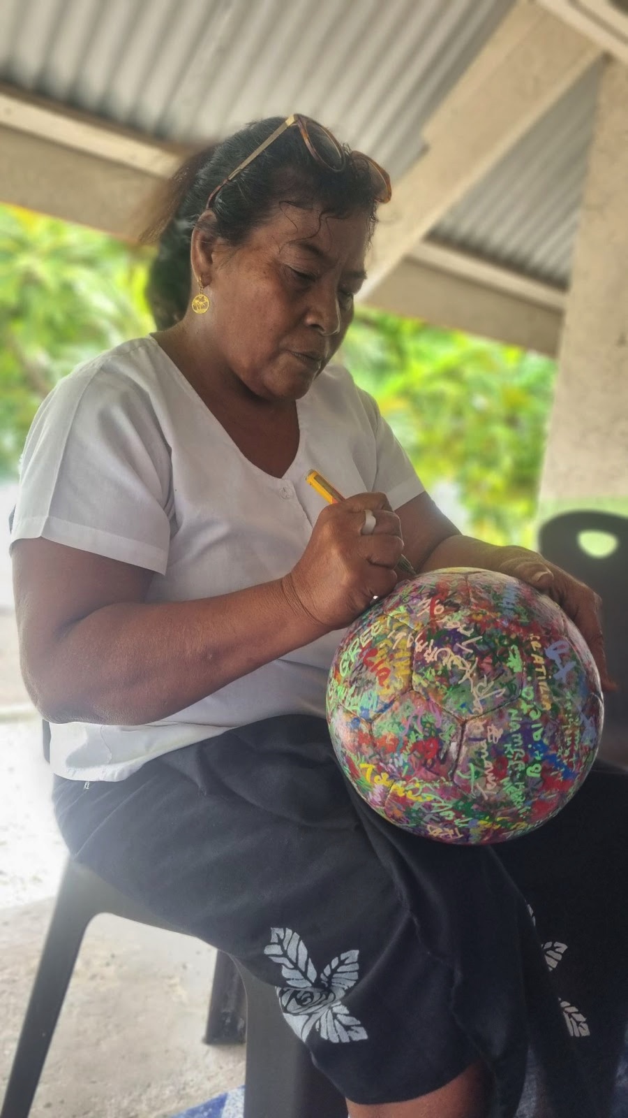 woman signing the Ball North Tarawa