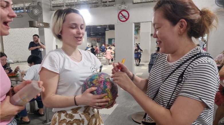 Iris holding The Ball