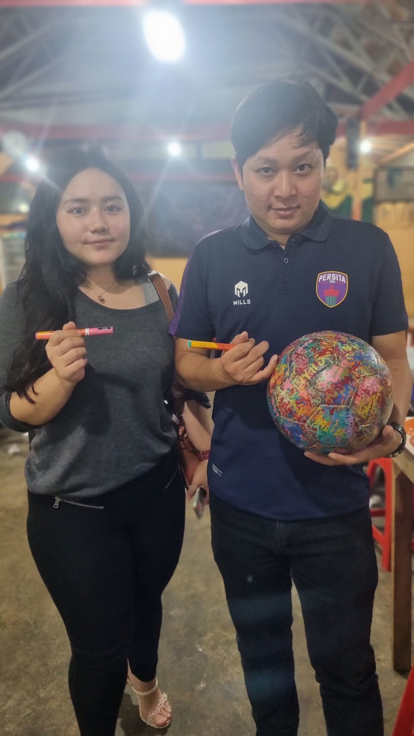Maya and Val being the first to sign The Ball in Indonesia