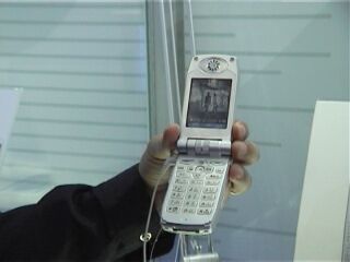 The phone shows the associated video