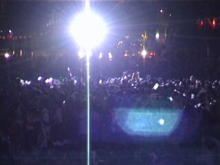 Spotlights illuminate the crowd in Seoul