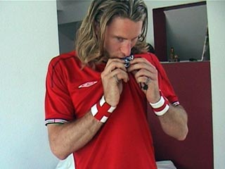 Andrew kisses the badge
